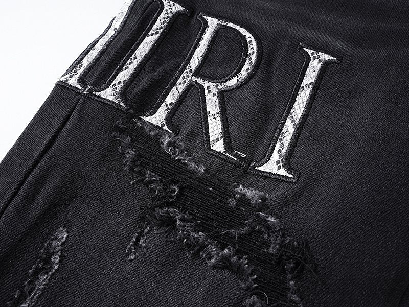 AMIRI Distressed Slim Tapered Jeans