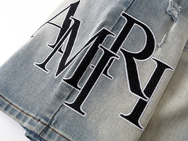 AMIRI Light Blue Distressed Monogram Denim Shorts