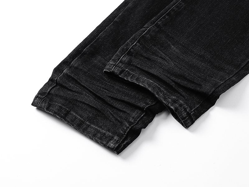AMIRI Black Distressed Ribbed Knee Jeans