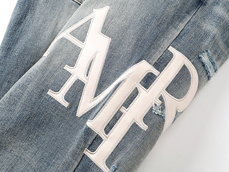 AMIRI Light Blue Distressed Letter Graphic Jeans