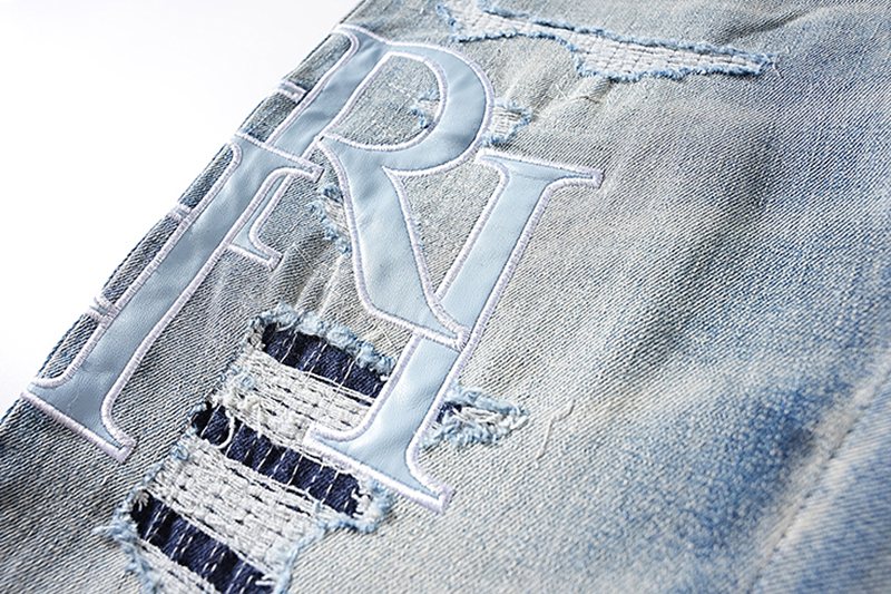 AMIRI Light Blue Letter Graphic Distressed Jeans