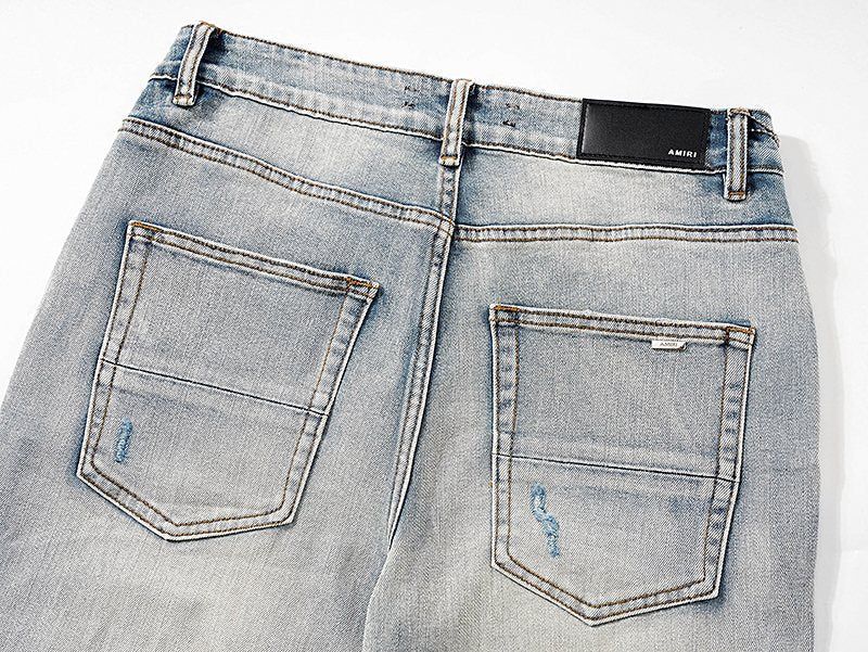AMIRI Light Blue Distressed Ripped Knee Jeans