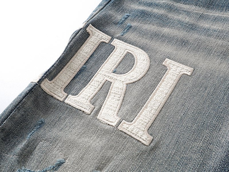 AMIRI Light Blue Distressed Letter Applique Jeans