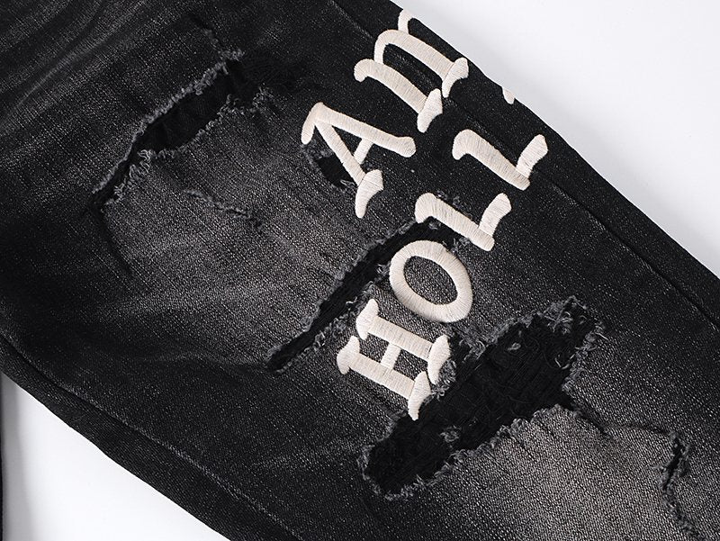 AMIRI Hollywood Lettering Distressed Jeans in Black