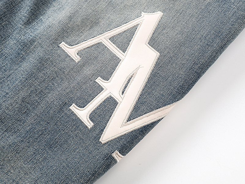 AMIRI Light Blue Distressed Appliqué Jeans