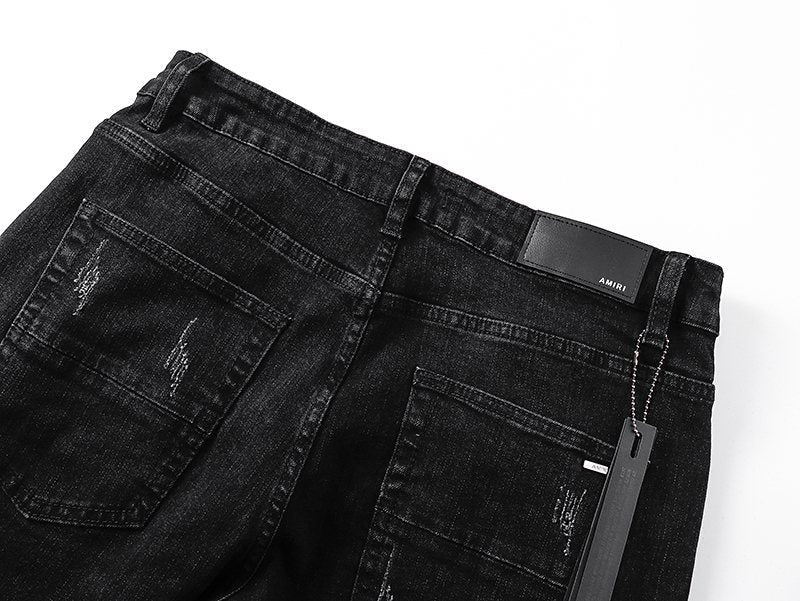 AMIRI Black Distressed Ribbed Knee Jeans