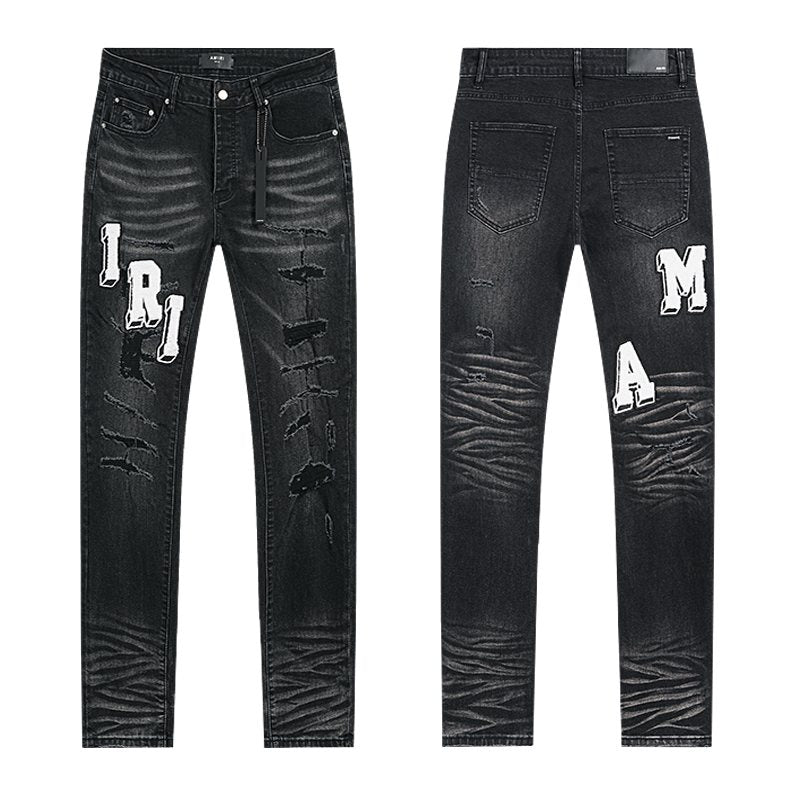 AMIRI Varsity Letter Appliqué Distressed Jeans