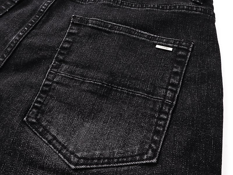 AMIRI Varsity Letter Appliqué Distressed Jeans