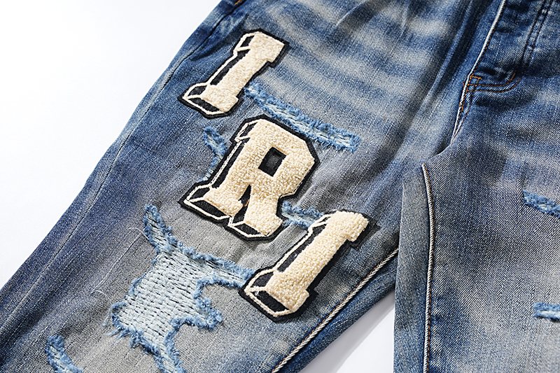 Amiri Varsity Letter Patch Distressed Jeans