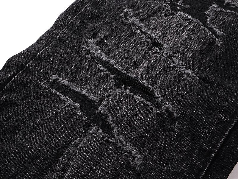 AMIRI Varsity Letter Appliqué Distressed Jeans