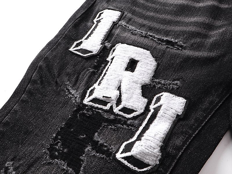 Amiri Varsity Letter Patch Distressed Jeans