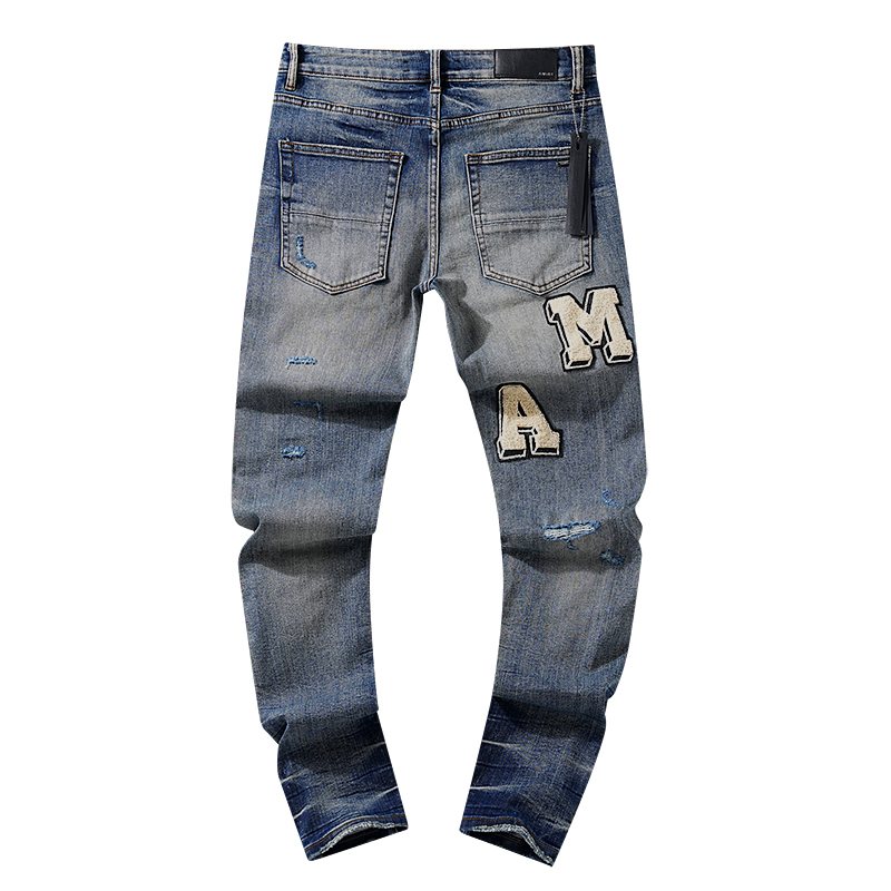 AMIRI Varsity Letter Appliqué Distressed Jeans